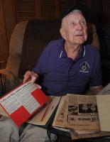 World War II veteran Ray Rogers, 95, of Inman was among the troops on Utah Beach during the D-Day invasion June 6, 1944. As the 67th anniversary of D-Day approaches, Rogers looks back on his service to his country. Here Rogers shows off his scrap book from the war.